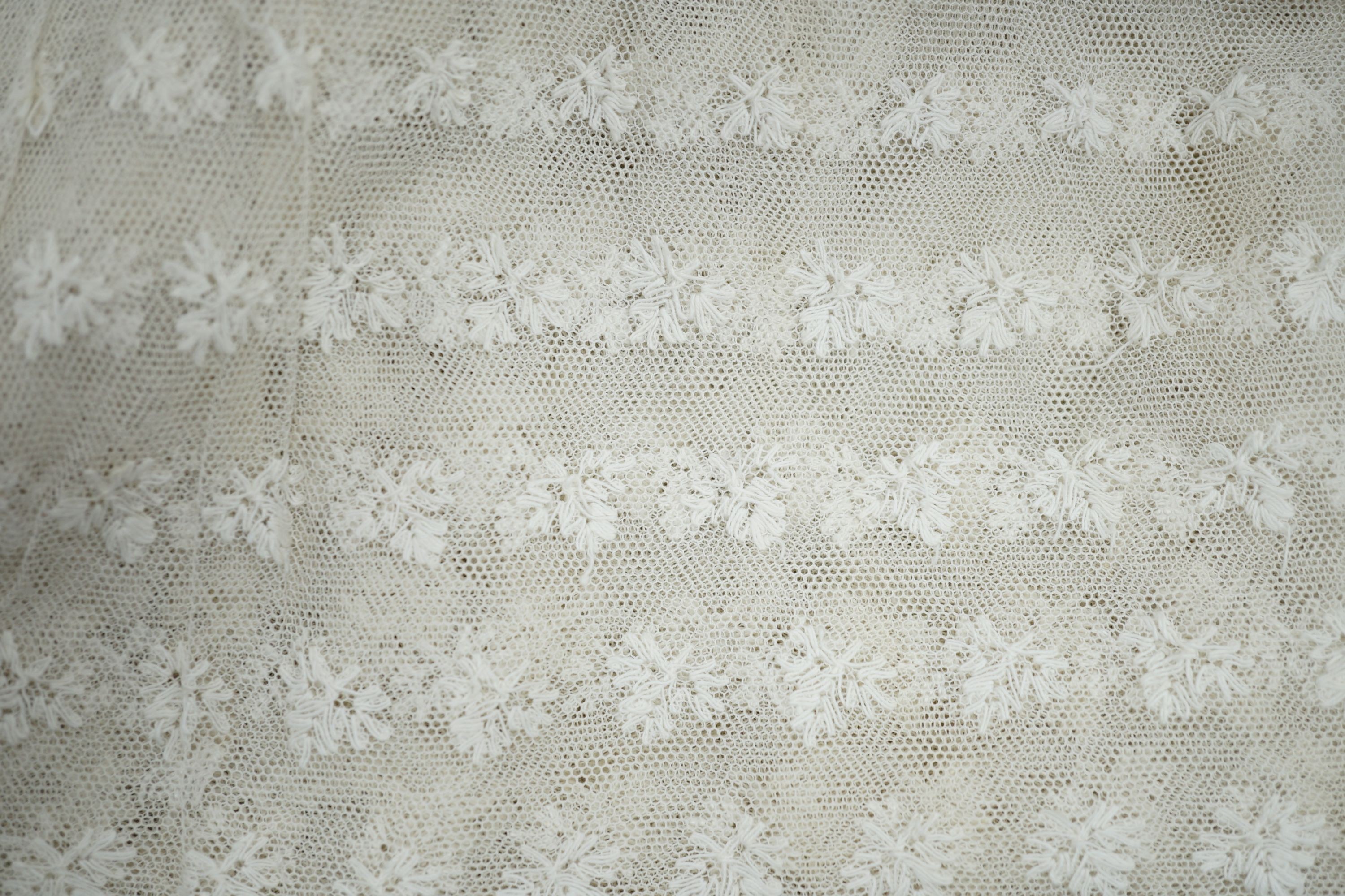 A needle lace skirt panel, a similar stole, various machine laces and trimmings